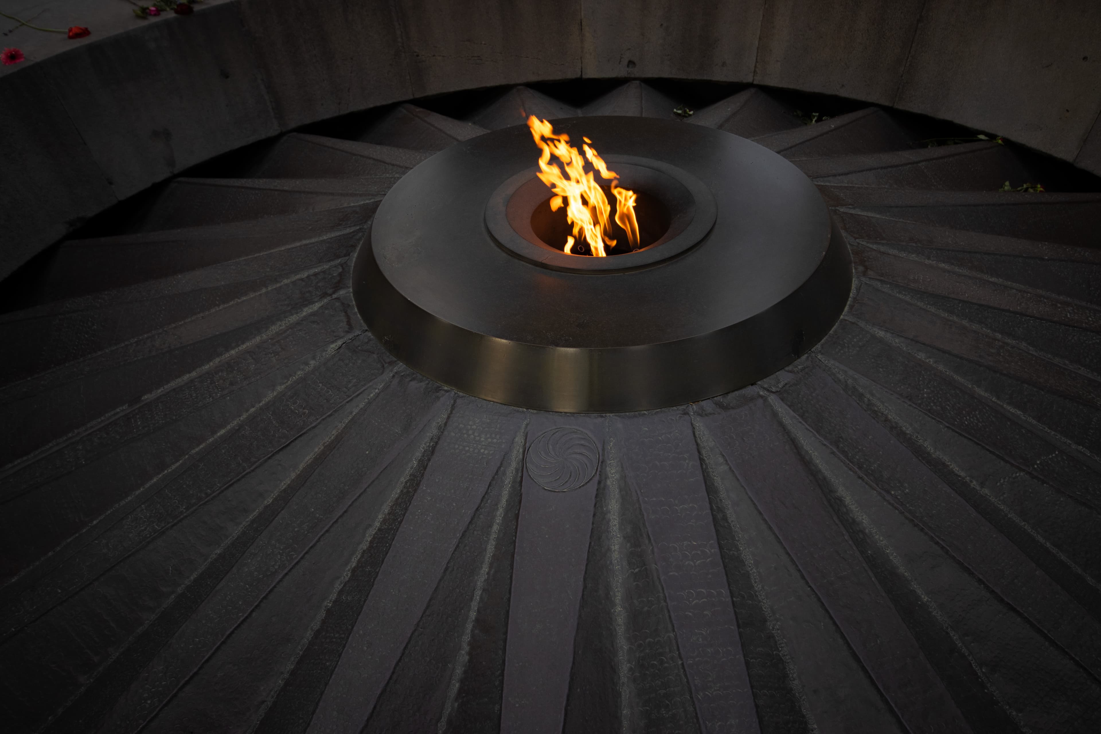 The eternal flame at the centre of the twelve inclined basalt slabs of the Tsitsernakaberd memorial.